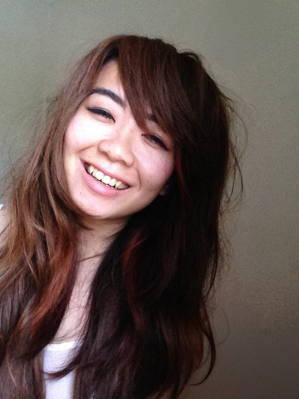 Happy woman with long brown hair, about me