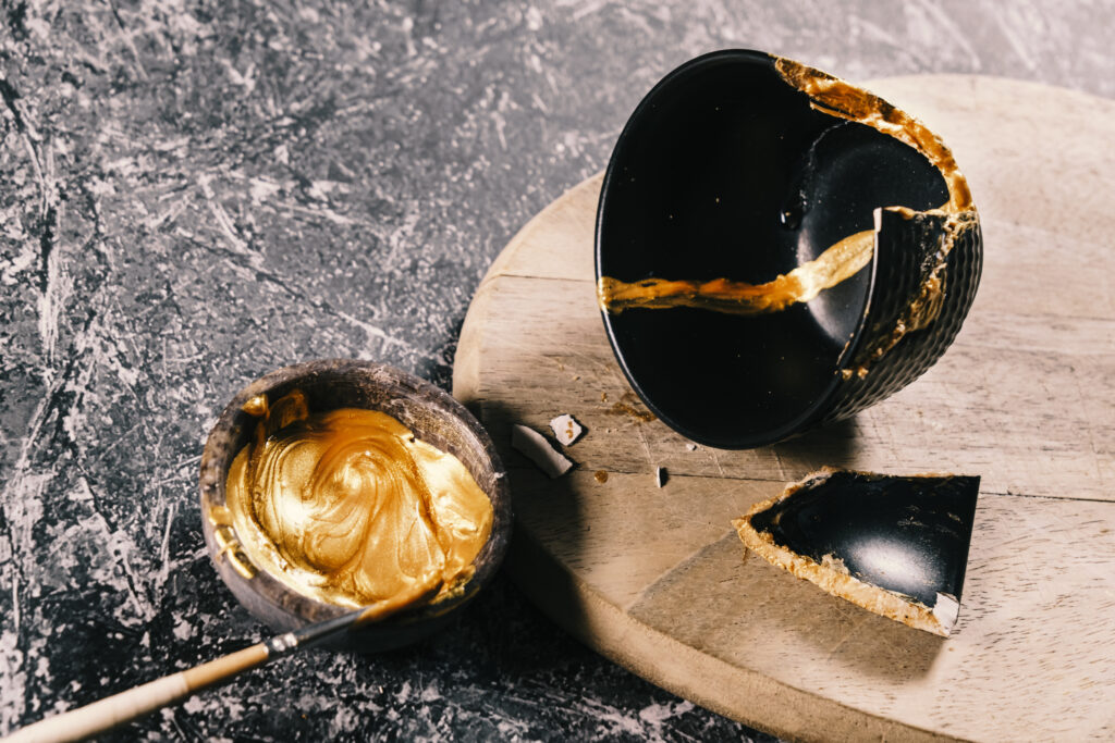 Kintsugi bowl being repaired with gold