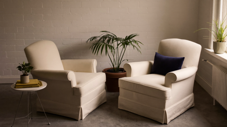 Two armchairs facing each other in a calm counselling room