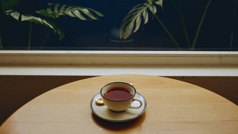 Morning tea by a window with soft tropical light