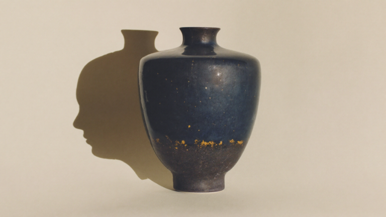 Ceramic vase whose silhouette suggests two facing profiles